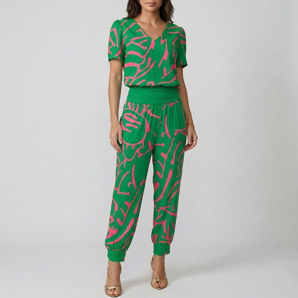 Elegant mönstrad jumpsuit för damer med V-ringning i helfigur