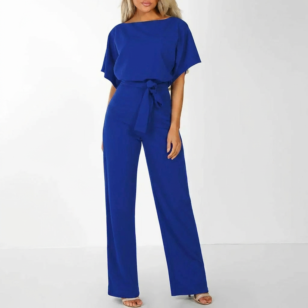Baksida av elegant svart jumpsuit för dam med skärp och moderna linjer