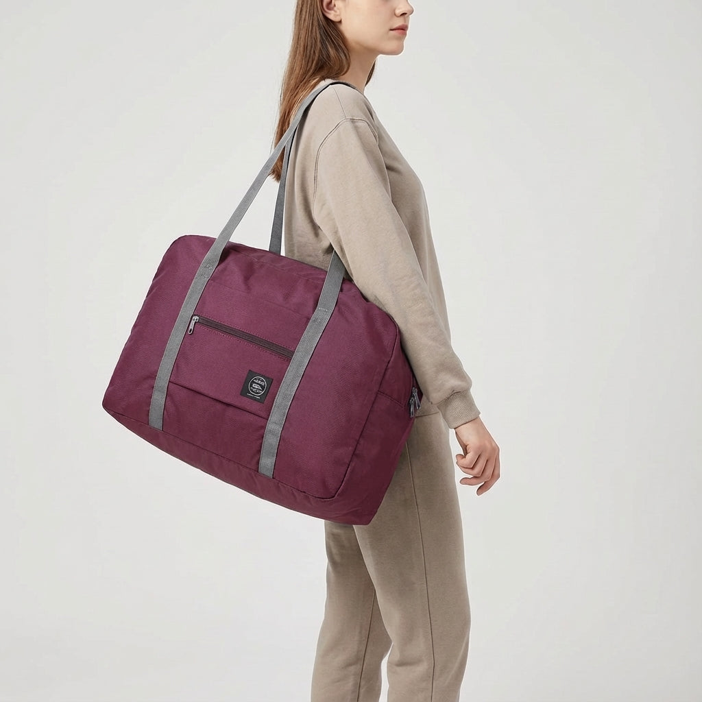 Smart reseväska, hopfällbar och lätt. Handbagage-godkänd med trolleyfäste för enkel transport. Ideell för flyg.