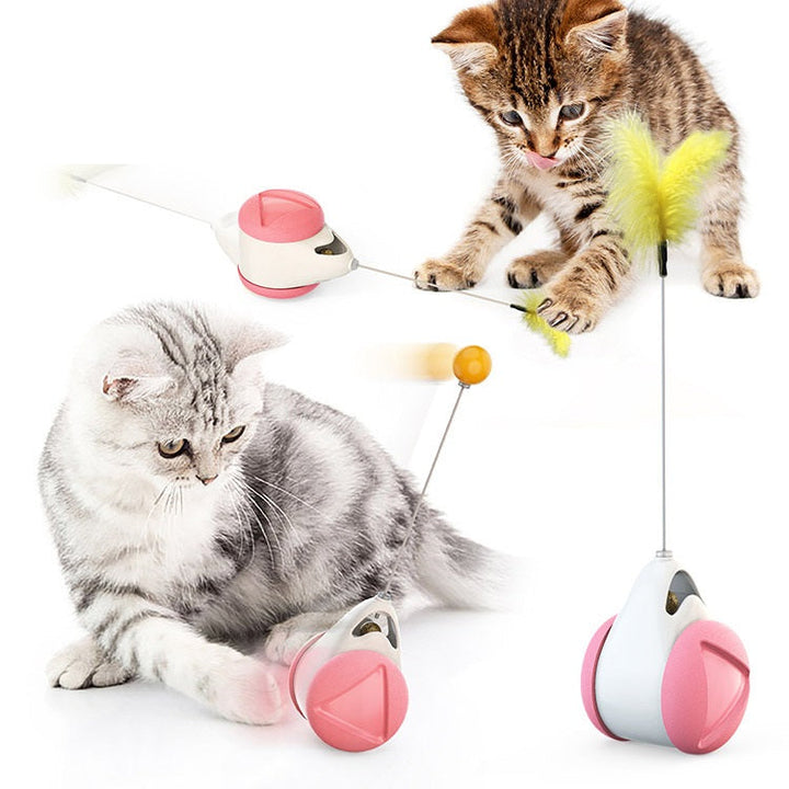 Katt leker entusiastiskt med självbalanserande interaktiv kattleksak; främjar fysisk aktivering.