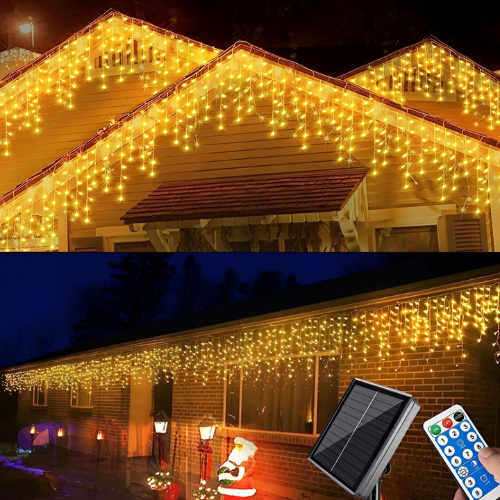 LED-gardinslinga med varmt ljus upplyst på ett hus tak och vägg