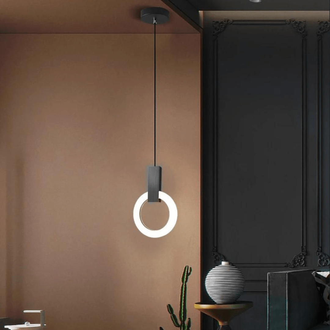 Svart nordisk cirkelformad LED hänglampa i modern miljö