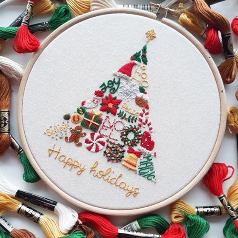 "Juladventskalender broderikit med festligt mönster och träram, perfekt för att skapa minnesrika helgdagar."