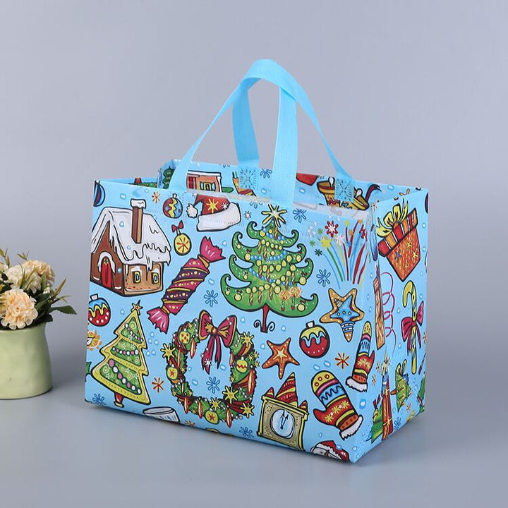 Julig presentpåse i ovävt tyg med slumpmässiga färgglada mönster, perfekt för julklappar, slitstark och återanvändbar accessoar.