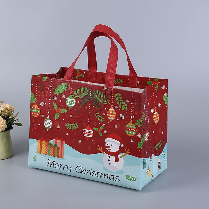 Julig presentpåse i ovävt tyg med slumpmässiga färgglada mönster, perfekt för julklappar, slitstark och återanvändbar accessoar.