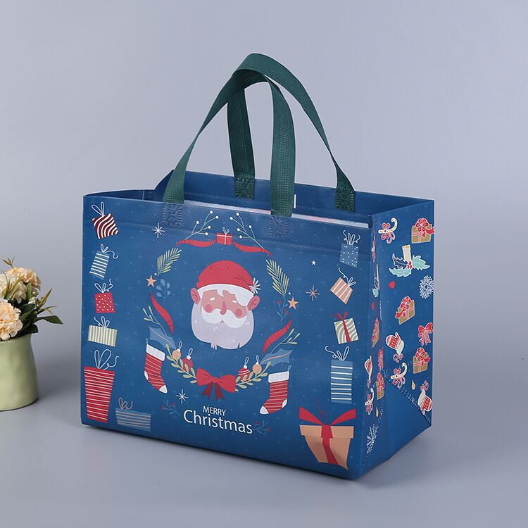 Julig presentpåse i ovävt tyg med slumpmässiga färgglada mönster, perfekt för julklappar, slitstark och återanvändbar accessoar.