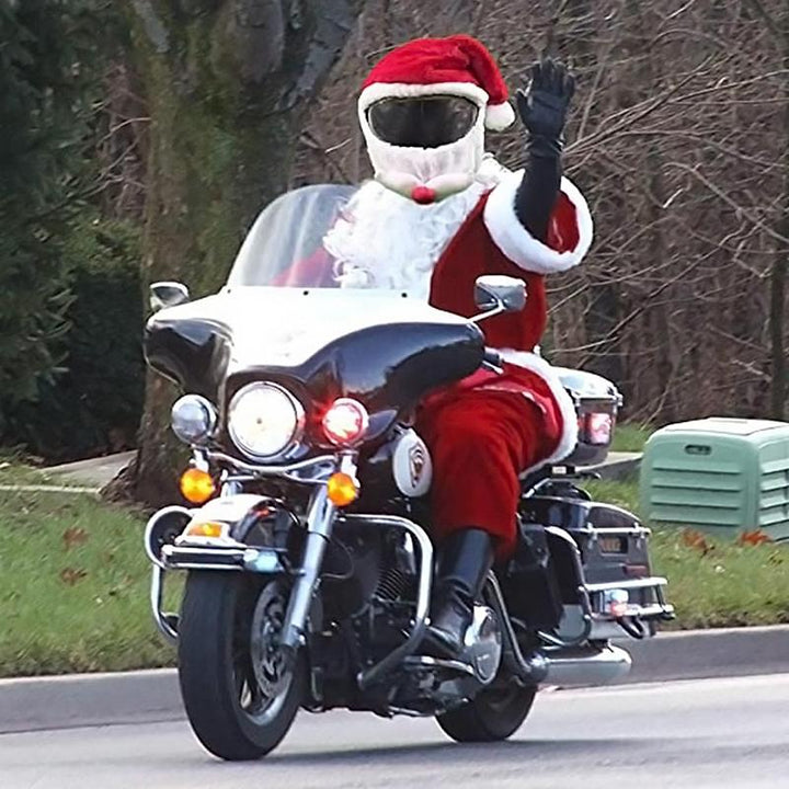 "Julmotorcykelhjälmskydd med tomtemotiv, röd och vit design, ger festlig känsla och skydd under julens motorcykelturer."