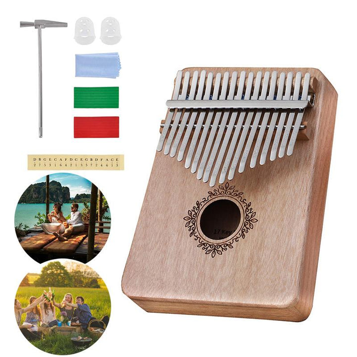 "Kalimba i mahogny med 17 metalltangenter, visad i närbild, ger melodiskt och varmt ljud, perfekt för portabelt spel."