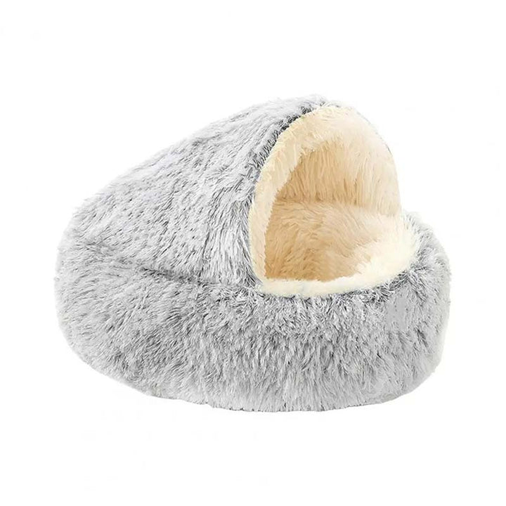 Bekväm kattbädd i plysch med tak. En mysig och varm grotta som husdjurssäng för trygg avkoppling.