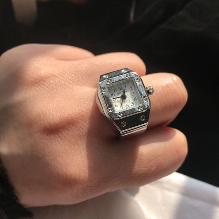 "Klockring med unisex design i olika färger, visar elegant rem och klart urtavlans display, perfekt för par."