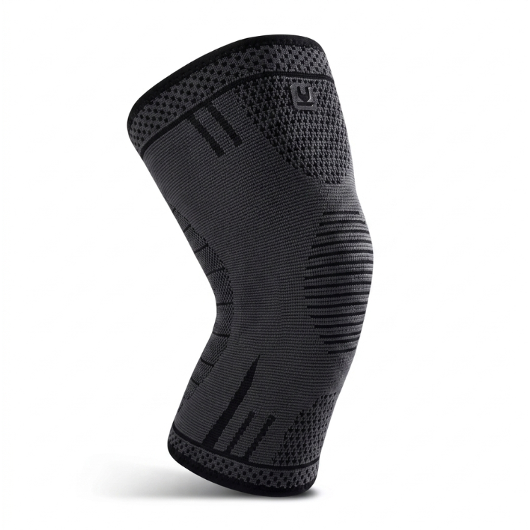 Nära på det elastiska materialet i ett sportigt knäskydd
