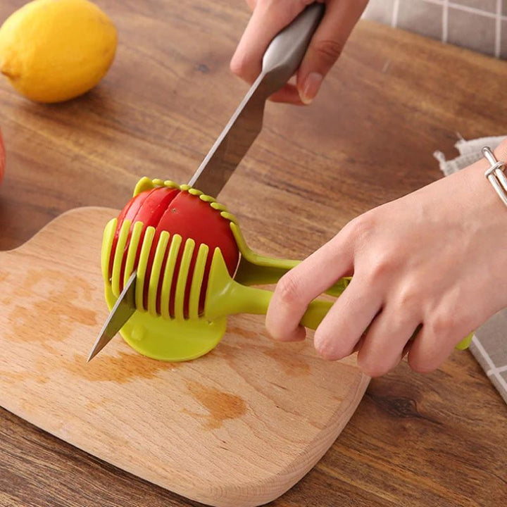 Köksverktyg för snabb slicing i grön och svart ABS-plast, med ergonomiska handtag, för säker och snabb skärning av frukt och grönsaker.