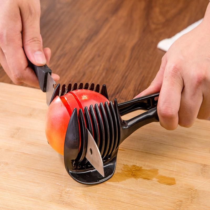 Köksverktyg för snabb slicing i grön och svart ABS-plast, med ergonomiska handtag, för säker och snabb skärning av frukt och grönsaker.