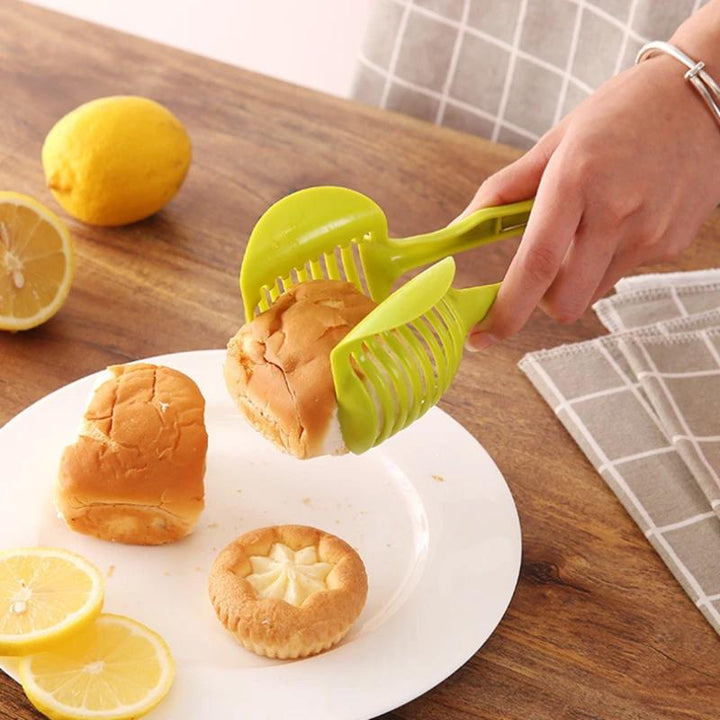 Köksverktyg för snabb slicing i grön och svart ABS-plast, med ergonomiska handtag, för säker och snabb skärning av frukt och grönsaker.