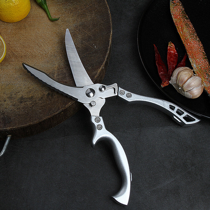 "Kraftiga kökssaxar i rostfritt stål, ergonomisk design, skarp blad för kycklingben och kött."
