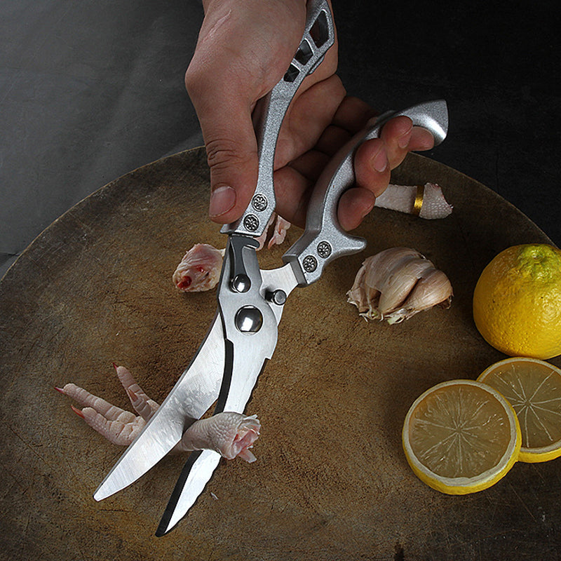 "Kraftiga kökssaxar i rostfritt stål, ergonomisk design, skarp blad för kycklingben och kött."