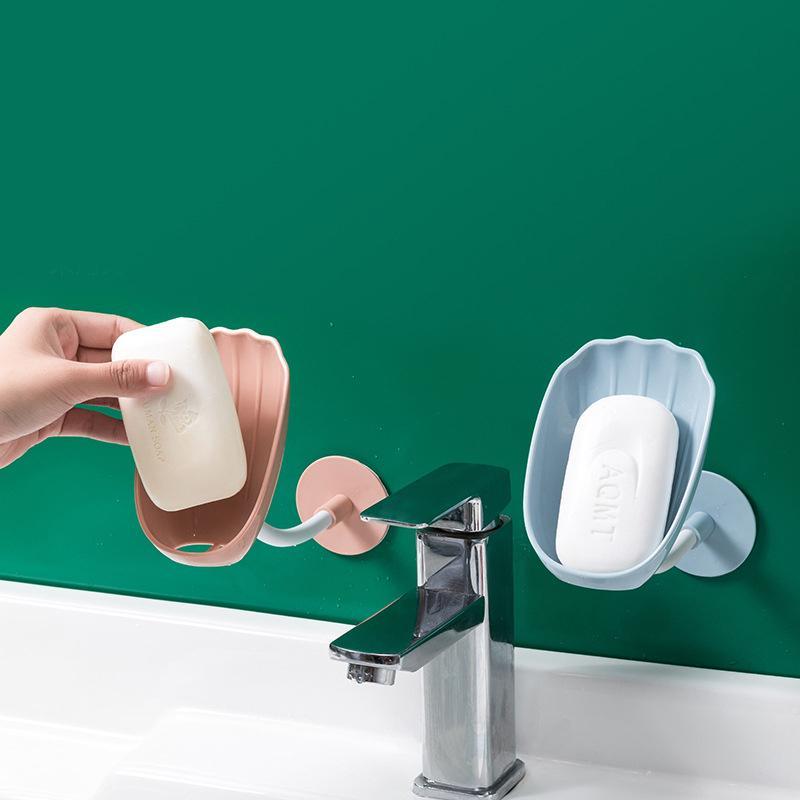 Kreativ vridbar tvålhållare i skaldesign och flera färger, justerbar för optimal dränering i badrum och kök.
