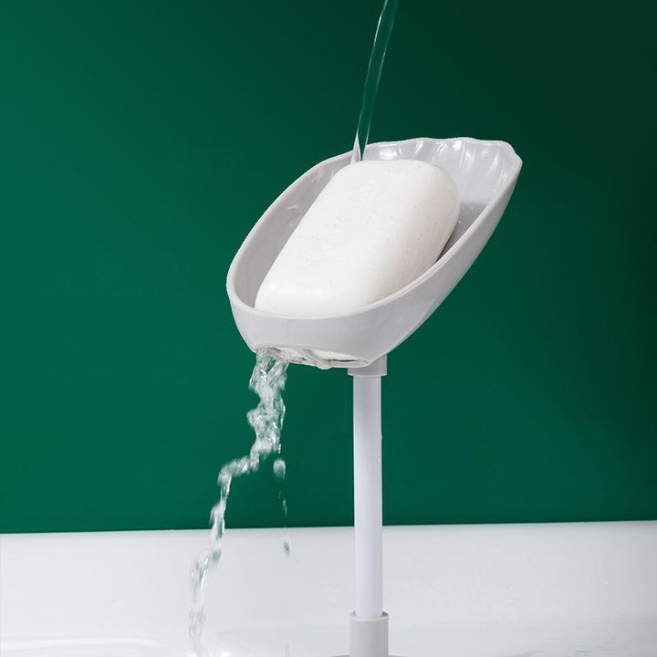Kreativ vridbar tvålhållare i skaldesign och flera färger, justerbar för optimal dränering i badrum och kök.