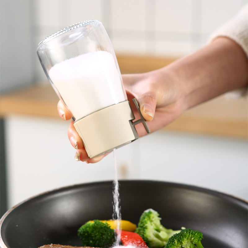 Kvantitativ kryddflaska med tryckfunktion, elegant glasdesign, exakt dosering, köksprodukt, 180 ml kapacitet.