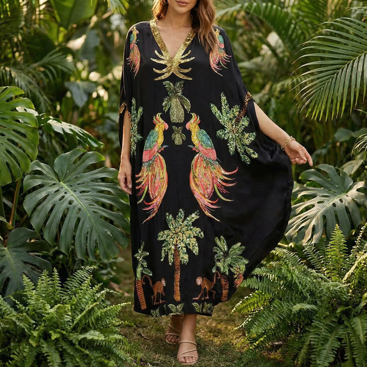 Kvinnors ankellånga kaftan Addison. Lös passform, luftig design för bekväm sommarstil och avkoppling vid stranden.