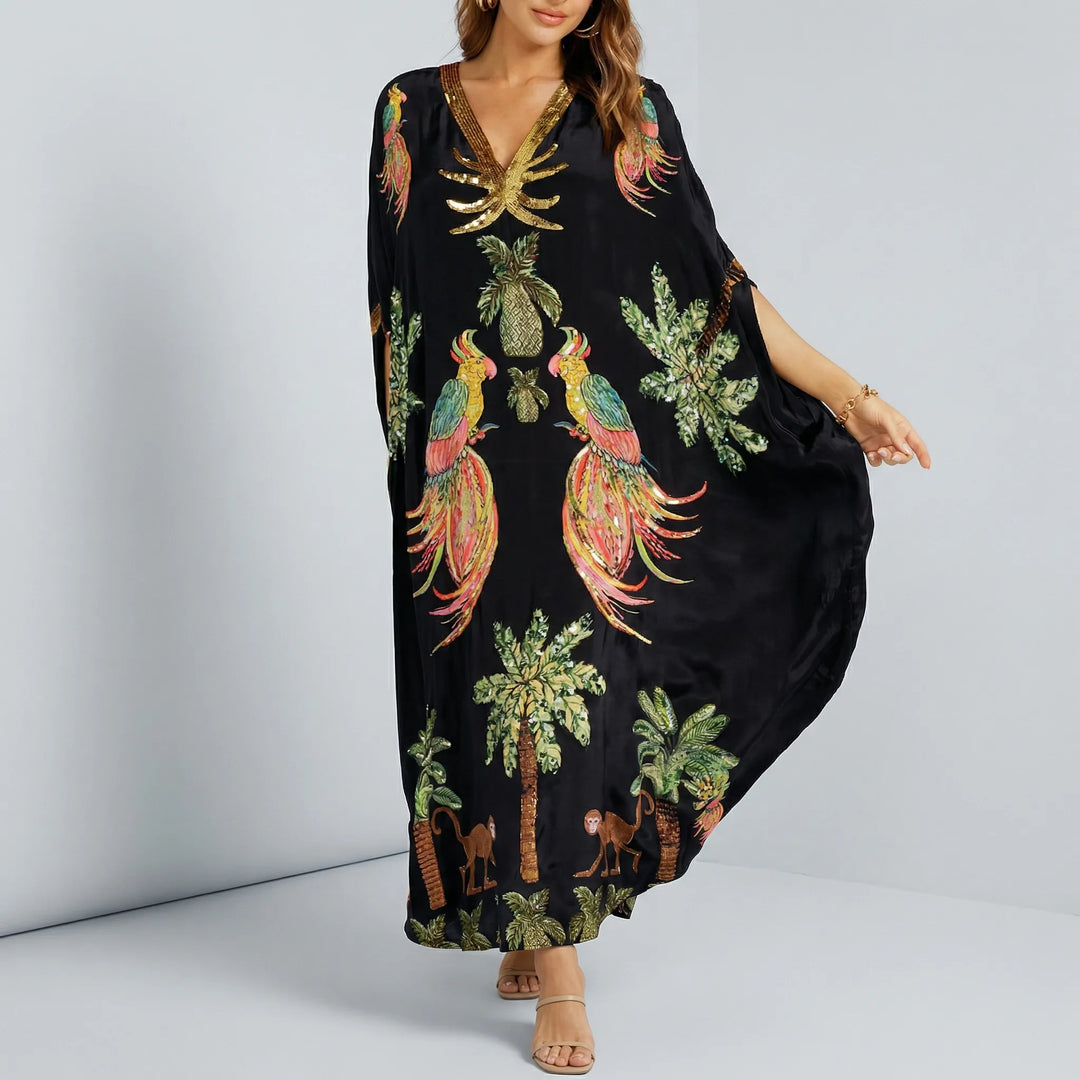 Mångsidig kvinnors kaftan med v-ringning. Lös passform, ankellång sommarklänning för både strand och vardag.