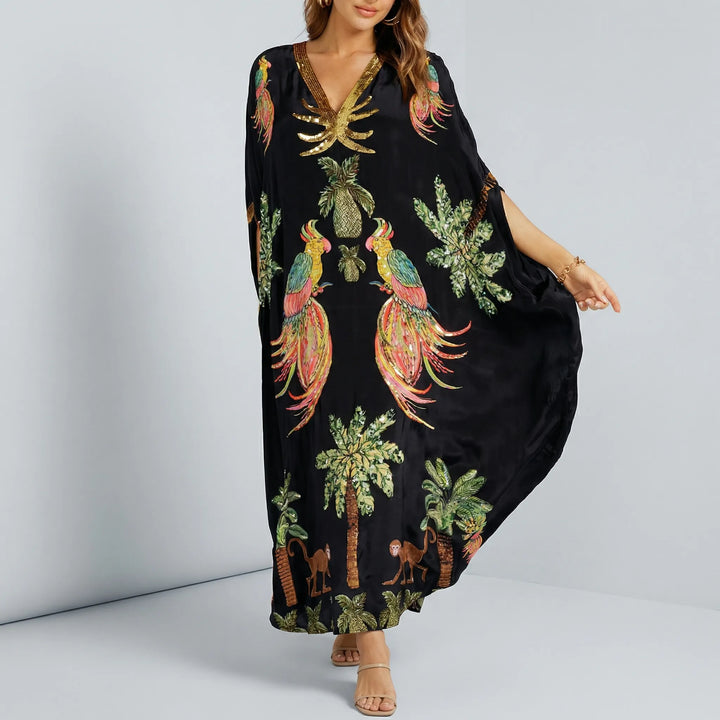 Mångsidig kvinnors kaftan med v-ringning. Lös passform, ankellång sommarklänning för både strand och vardag.