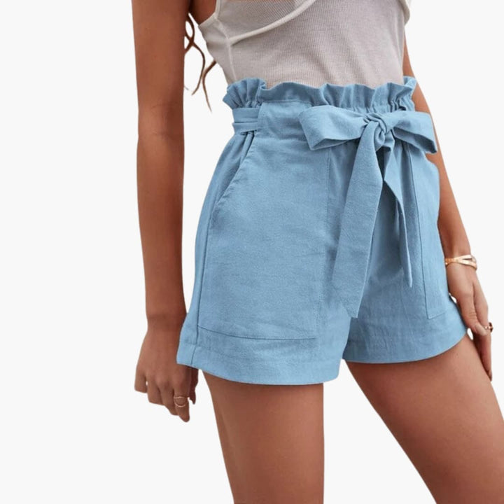 Damshorts med knytband & fickor, perfekt för sommarens mode & komfort.
