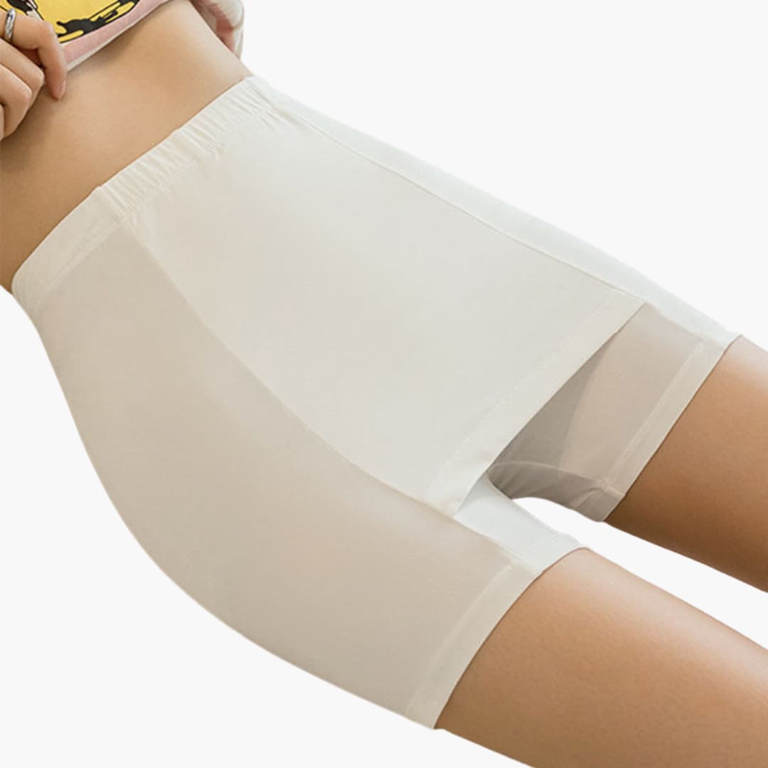 Pådragbar kvinnors kjolshorts med bred elastisk midja och integrerade innerbyxor, ger komfort och rörelsefrihet.