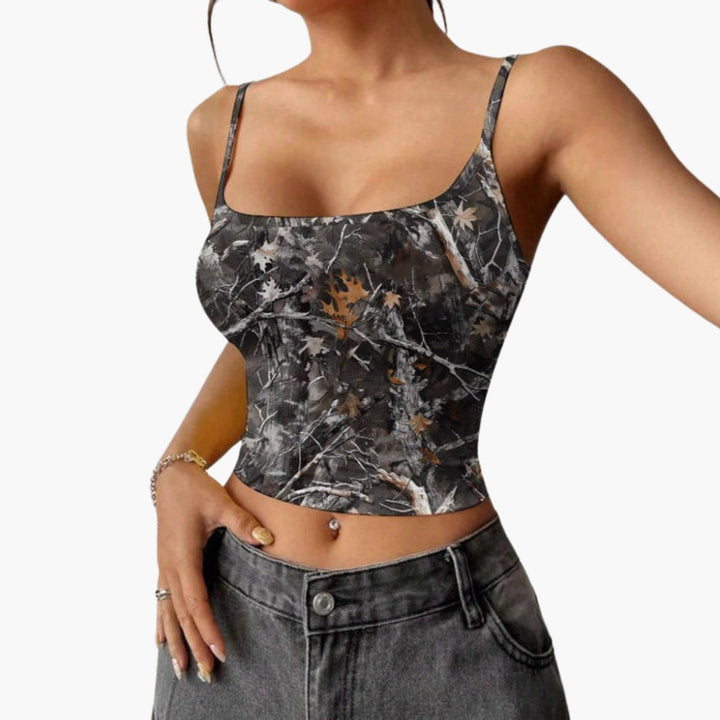 Trendig croppad damtopp med fyrkantig hals. Ärmlös axelbandstopp för en modern sommarlook.