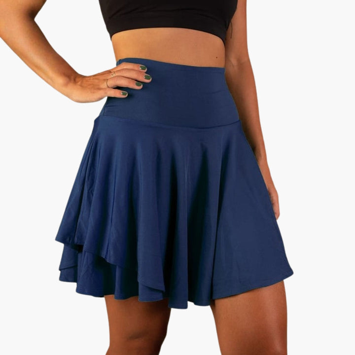 Kvinnors högmidjade sportskort med inbyggda shorts för träning, aktivkläder och fritid. Bekväm passform.