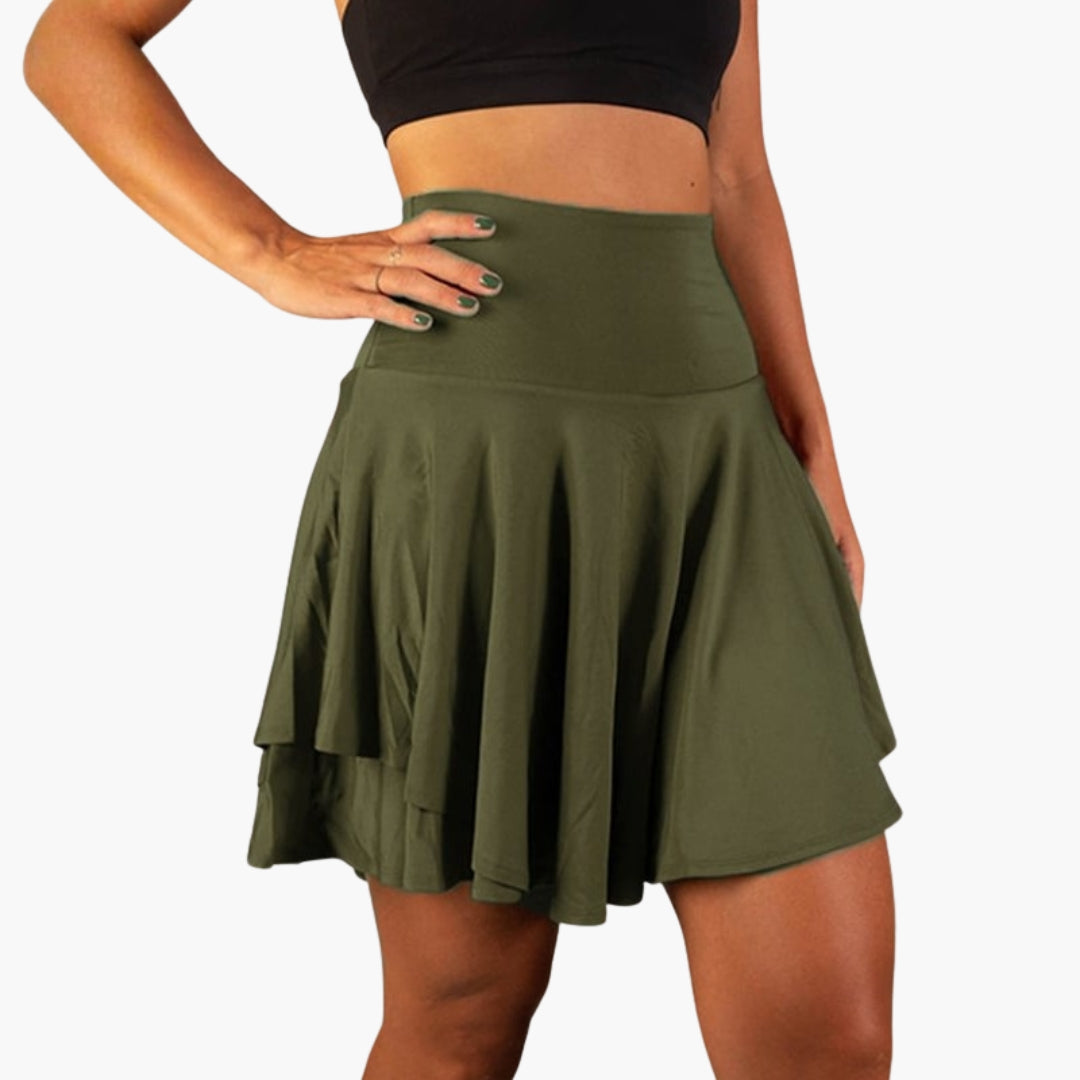 Gröna högmidjade sportskort med stretch för kvinnor. Inbyggda shorts för komfort under aktivitet.