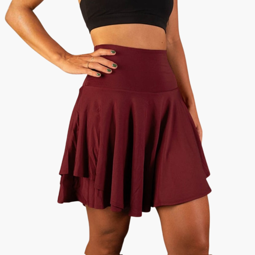 Högmidjade sportskort för kvinnor med ventilerande inbyggda shorts. Optimala för varma sommardagar.