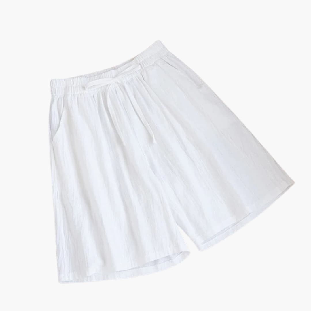 Detaljbild: Elastiskt midjeband på knälånga damshorts. Komfortabel, avslappnad passform för bekväma shorts.
