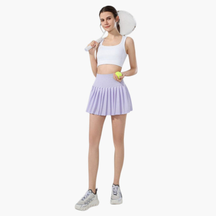 Stilsäkra mörkgröna damkjolshorts med dragsko. Kombinerar kjolens elegans med shortsens funktion.