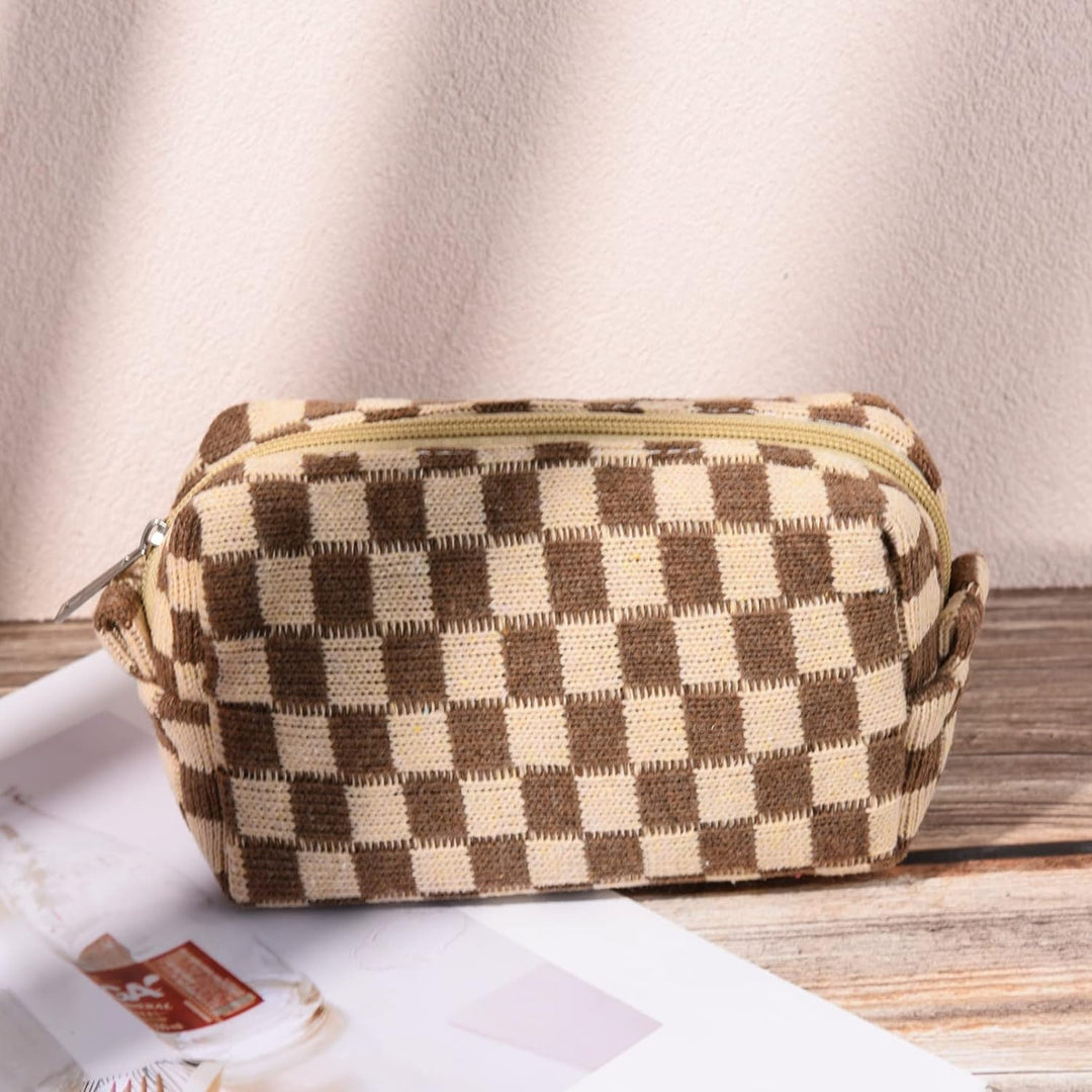 Elegant rutig necessär set. En modeaccessoar för skönhetsförvaring på resande fot.