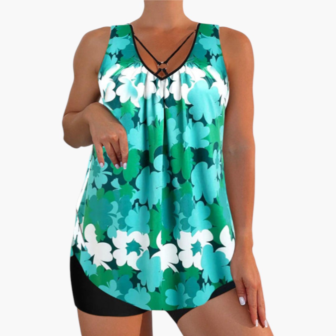 Bekvämt dam tankiniset med blommig topp och matchande shorts. Idealisk för sommarstil & strandmode.