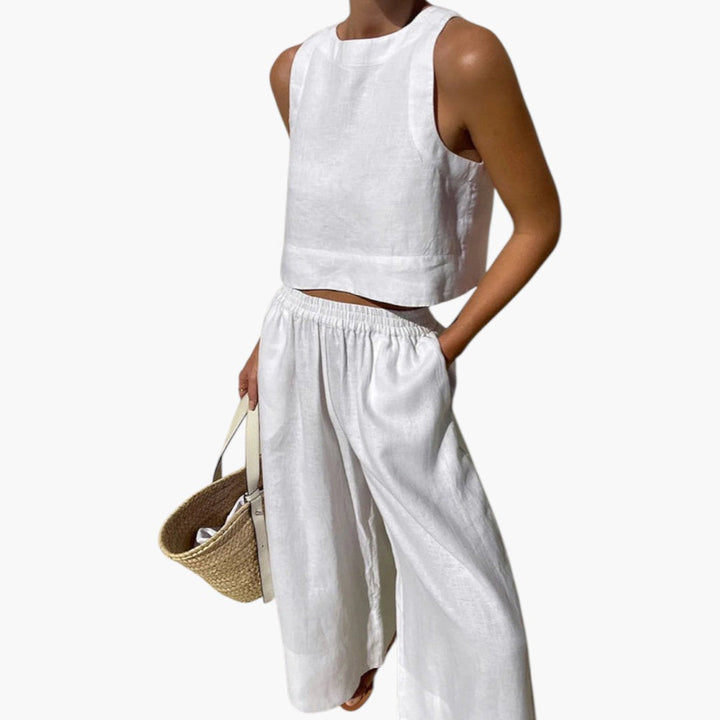 Bekvämt kvinnors sommarset med ärmlös crop top och vida byxor, idealiskt som elegant loungewear.