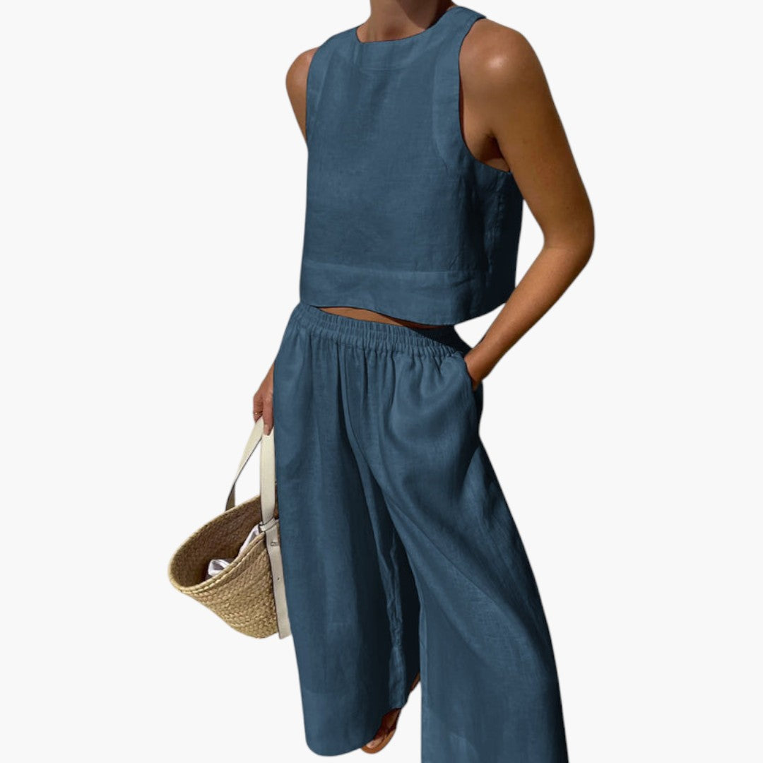 Lätt och luftigt sommarset för dam med ärmlös crop top och flödande vida byxor för varma dagar.