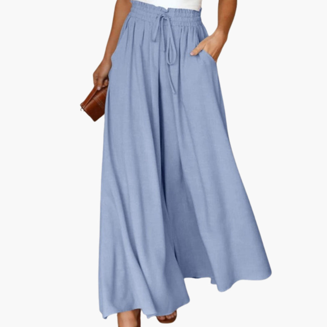 Kvinnors vida byxor med dragsko i midjan, perfekt för en avslappnad sommarlook. Bekväma långbyxor.