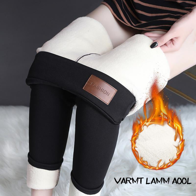 Vintertäta leggings för dam i grått, som framhäver den formande passformen och komforten.