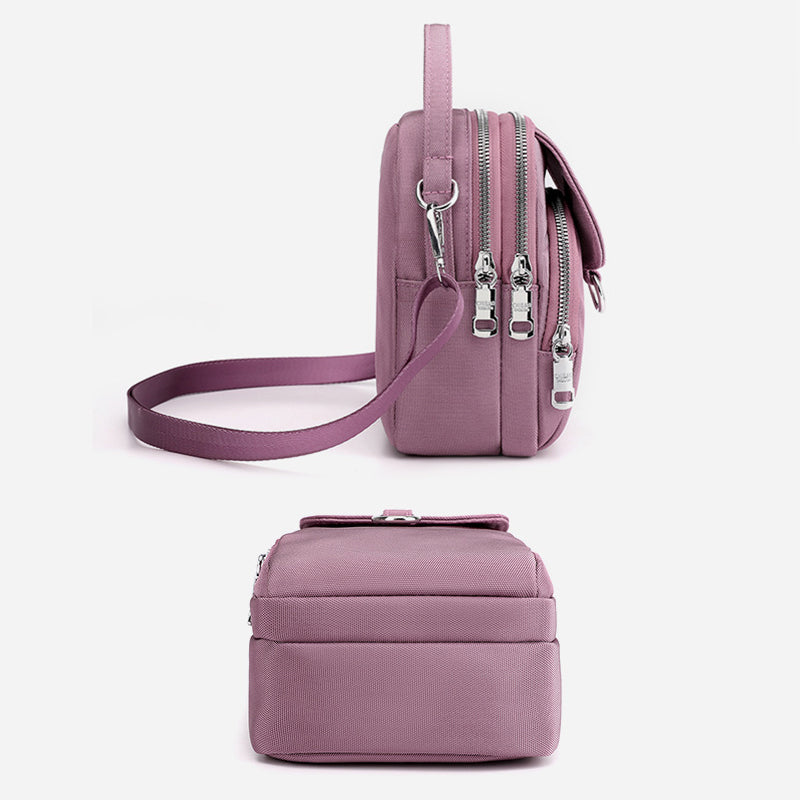 "Lätt vattentät unisex crossbody-väska i nylon med flera fickor, justerbar axelrem, kompakt och funktionell design"