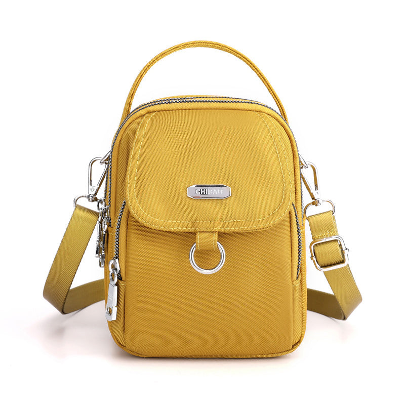 "Lätt vattentät unisex crossbody-väska i nylon med flera fickor, justerbar axelrem, kompakt och funktionell design"