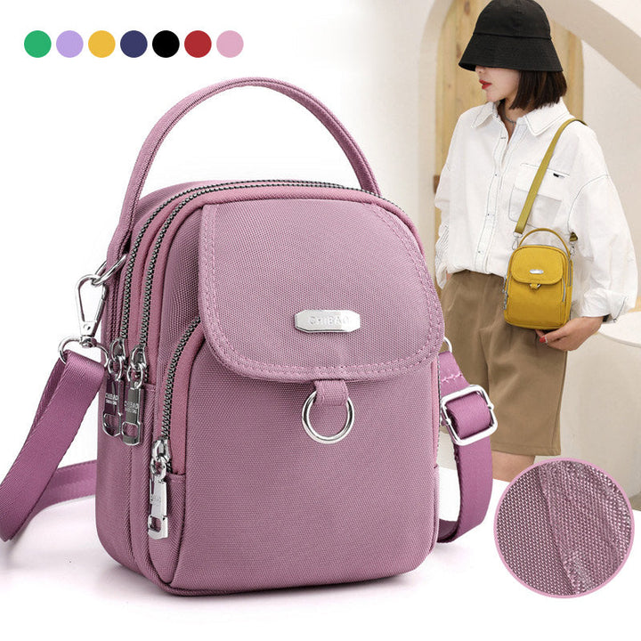 "Lätt vattentät unisex crossbody-väska i nylon med flera fickor, justerbar axelrem, kompakt och funktionell design"