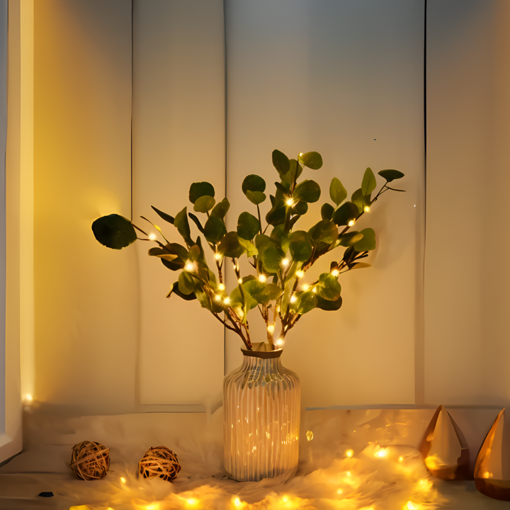 Detaljbild av Glimrande LED grenlampa, designad som en olivgren, för elegant heminredning.