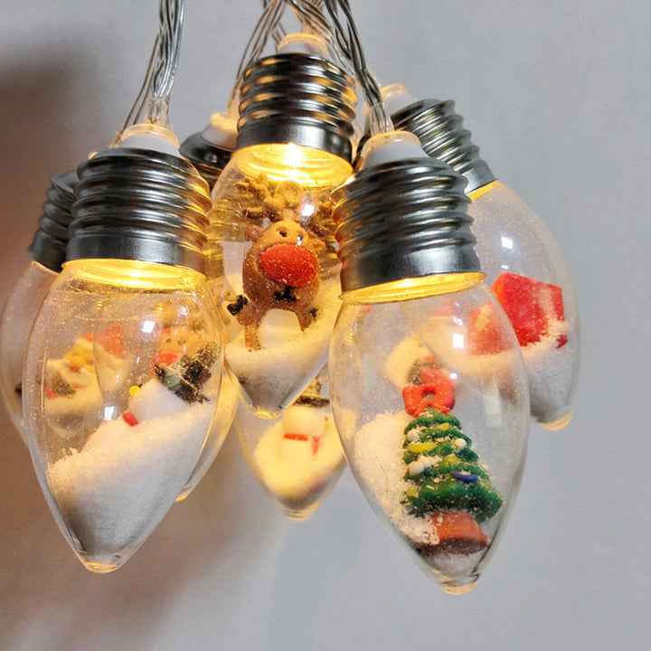 "LED-ljussträngar med julmotiv som renar och snögubbar skapar magisk stämning i hemmet."