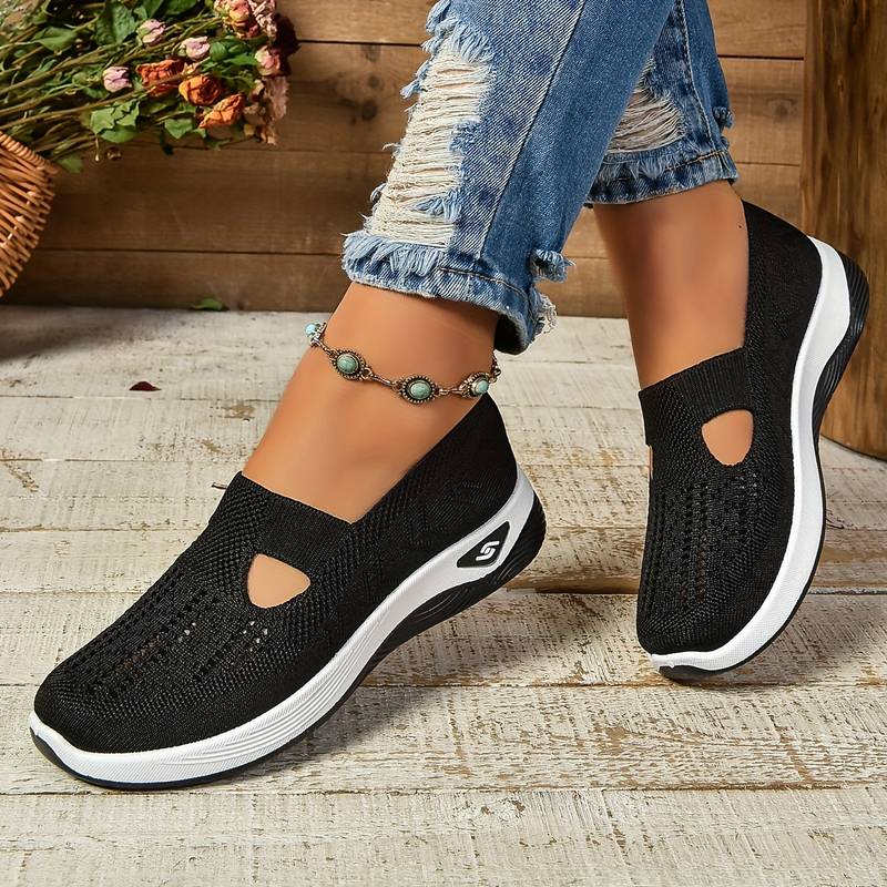Svart dam sneakers med mjuk ovandel och slip-on design
