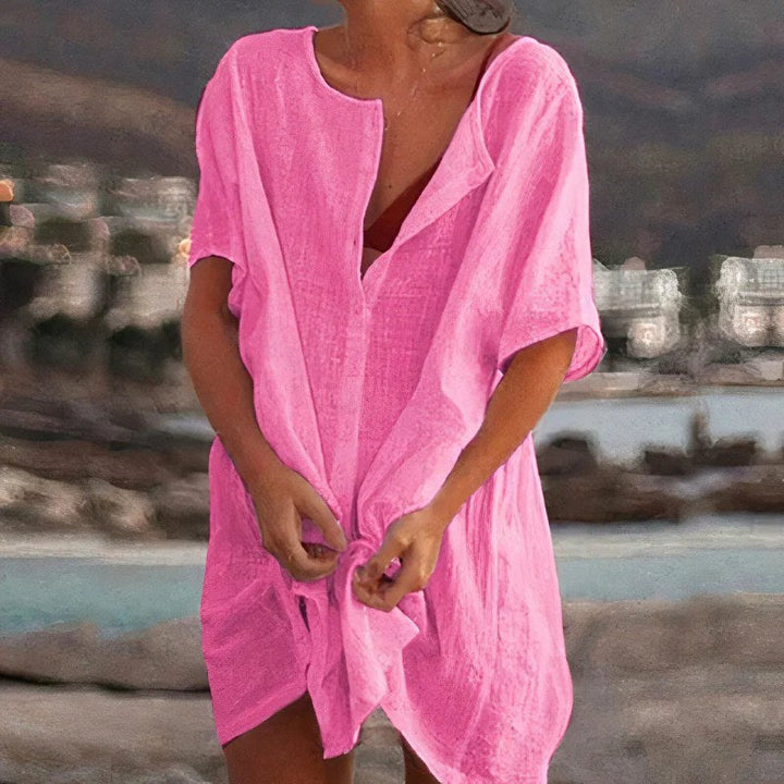 Trendig sommarblus med V-ringning och knytning för en avslappnad, chic look. Lättviktig och bekväm.