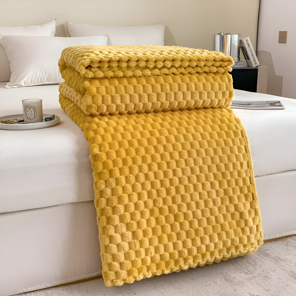 Hållbar och bekväm fleecefilt i plysch. Mjuk sofffilt, perfekt hemtextil för vardagsrummet.