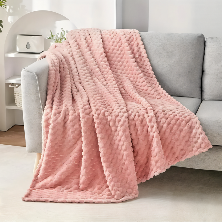 Lyxig sofffilt i mjuk fleece och plysch. Bekväm hemtextil som förgyller vardagsrummet. Värmande.