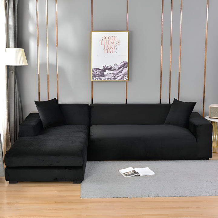 Levande blått stretch sofföverdrag i polyester, optimalt skydd mot fläckar och slitage.